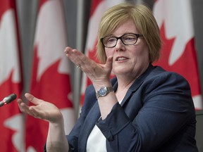 Employment, Workforce Development and Disability Inclusion Minister Carla Qualtrough gestures as she responds to a question during a news conference Thursday August 20, 2020 in Ottawa.