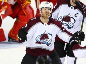 Colorado Avalanche Colin Wilson celebrates after scoring on goalie Mike Smith of the Calgary Flames in Game 5 of the Western Conference First Round during the 2019 NHL Stanley Cup Playoffs at the Scotiabank Saddledome in Calgary on Friday, April 19, 2019.