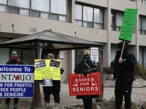 People gather for a rally on Sunday, Jan. 10 outside St. George Care Community, where 156 residents have tested positive for COVID-19 since the outbreak began Dec. 4, the highest number of infections of any long-term care home in the province during the second wave.