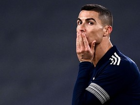 In this file photo taken on January 10, 2021 Juventus forward Cristiano Ronaldo reacts a match against Sassuolo at the Juventus stadium in Turin.