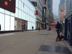 An image taken from a YouTube video showing a man who allegedly assaulted a woman near  Yonge and Dundas Sts.