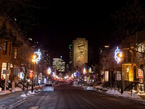 Crescent Street, a Montreal street known for its nightlife, is seen on the first night after a curfew is imposed by the Quebec government to help slow the spread of COVID-19, Jan. 9, 2021.