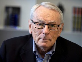 International Olympic Committee member Dick Pound poses in his offices in Montreal, Feb. 26, 2020.