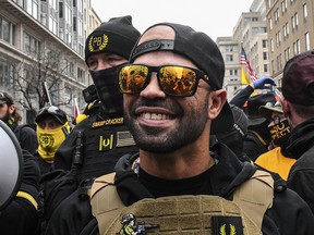 Enrique Tarrio, leader of the Proud Boys, stands outside Harry's bar during a protest on December 12, 2020 in Washington.