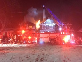 Fire crews battle a blaze on Gainsborough Rd. in Toronto Friday, Jan. 29, 2021.