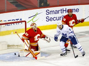 Calgary Flames goalie Jacob Markstrom is scored on by Toronto Maple Leafs Mitchell Marner in third period action at the Scotiabank Saddledome in Calgary on Tuesday, January 26, 2021.