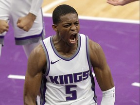 De'Aaron Fox of the Sacramento Kings reacts after a dunk.
