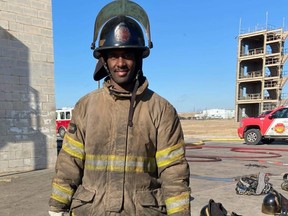 Jamar Wall in firefighting gear during a boot camp in Crowley, Texas.