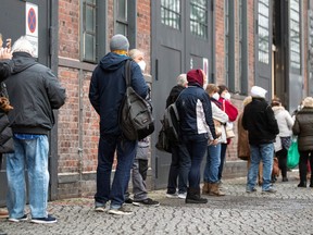 People queue at the coronavirus disease (COVID-19) vaccination centre at the Treptow Arena in Berlin, Germany January 4, 2021.