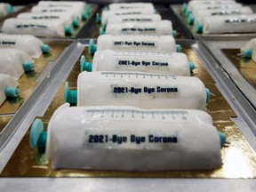 Cakes in the shape of syringes are seen at the Schuerener Backparadies bakery, as the vaccination rollout against COVID-19 continues, in Dortmund, Germany, Jan. 8, 2021.