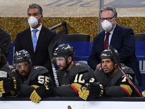 Henderson Silver Knights head coach Manny Viveiros (left) and general manager Kelly McCrimmon of the Vegas Golden Knights handle bench duties against the St. Louis Blues at T-Mobile Arena on January 26, 2021 in Las Vegas.
