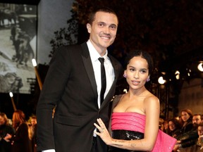 Zoe Kravitz and her boyfriend Karl Glusman pose for photographers as they arrive for the premier of the fantasy film, "Fantastic Beasts: The Crimes of Grindelwald," in Paris on Nov. 8, 2018.