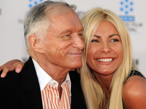 In this April 28, 2011 file photo, Crystal Harris is pictured with then-fiance, Hugh Hefner, at the TCM Classic film Festival opening night premiere of the film, "An American in Paris," in Hollywood, Calif.