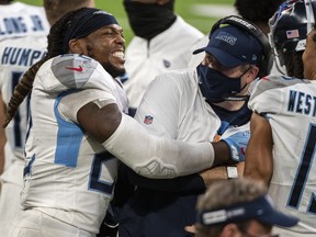 Derrick Henry of the Tennessee Titans celebrates with offensive coordinator Arthur Smith at the end of the game agains the Minnesota Vikings at U.S. Bank Stadium on September 27, 2020 in Minneapolis, Minnesota.