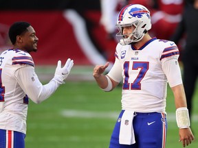 Quarterback Josh Allen #17 and wide receiver Stefon Diggs #14 of the Buffalo Bills talk before the NFL game against the Arizona Cardinals at State Farm Stadium on November 15, 2020 in Glendale, Arizona.