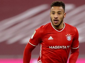 Corentin Tolisso of FC Bayern München runs with the ball during the Bundesliga match between FC Bayern Muenchen and VfL Wolfsburg at Allianz Arena on Dec. 16, 2020 in Munich, Germany.