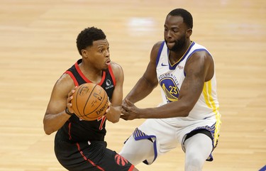 SAN FRANCISCO, CALIFORNIA - JANUARY 10:  Kyle Lowry #7 of the Toronto Raptors is guarded by Draymond Green #23 of the Golden State Warriors at Chase Center on January 10, 2021 in San Francisco, California. NOTE TO USER: User expressly acknowledges and agrees that, by downloading and or using this photograph, User is consenting to the terms and conditions of the Getty Images License Agreement.  (Photo by Ezra Shaw/Getty Images)