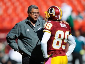 Philadelphia Eagles wide receivers coach David Culley talks with Santana Moss #89 of the Washington Redskins before a game at FedExField on October 16, 2011 in Landover, Maryland.