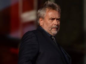 French director Luc Besson arrives for the red carpet event during the opening ceremony of the fifth Beijing International Film Festival at Yanqi Lake on the outskirts of Beijing on April 16, 2015.