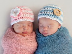 Sleeping baby girl and boy.
