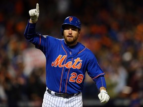Daniel Murphy of the New York Mets celebrates after hitting a solo home run in the first inning against Jon Lester of the Chicago Cubs during game one of the 2015 MLB National League Championship Series at Citi Field on October 17, 2015 in the Flushing neighborhood of the Queens borough of New York City.
