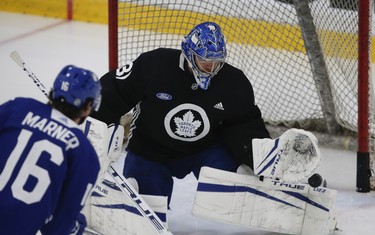 Toronto Maple Leafs Frederik Andersen G (31) makes a save on Mitch Marner (16) at practice in Toronto on Tuesday January 12, 2021. Jack Boland/Toronto Sun/Postmedia Network