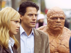 Ioan Gruffudd (middle) talks with co-stars Jessica Alba and Michael Chiklis in the Fantastic Four.