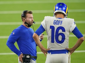 Los Angeles Rams coach Sean McVay talks with quarterback Jared Goff (16) in the second half against the Dallas Cowboys at SoFi Stadium.