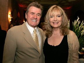 Actor John Reilly (left) and actress Sharon Wyatt attend the annual Daytime Emmy nominee party at the Hollywood Roosevelt Hotel in Hollywood, Calif., April 27, 2006.