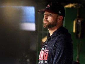 Corey Kluber of the Cleveland Indians looks on from the dugout at Progressive Field on October 11, 2017 in Cleveland.