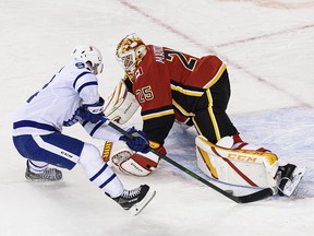 Calgary Flames goalie Jacob Markstrom makes a save on Toronto Maple Leafs forward Alexander Barabanov at the Saddledome on Sunday, January 24, 2021.