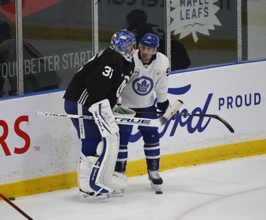 Toronto Maple Leafs John Tavares C (91) discusses something with Frederik Andersen G (31) at practice in Toronto on Tuesday January 12, 2021. Jack Boland/Toronto Sun/Postmedia Network ORG XMIT: POS2101121548021094