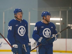 Auston Matthews (left) and Morgan Rielly at Toronto Maple Leafs training camp on Jan. 6, 2021..