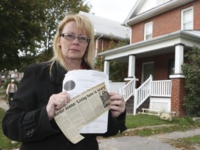 Lisa Freeman stands in front of the Oshawa house where her father was killed 25 years ago on Wednesday, Oct. 23, 2013.
