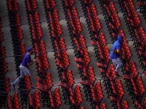 Players for the New York Mets head off the field after warm ups before the start of the game against the Boston Red Sox at Fenway Park in Boston, July 28, 2020.