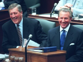 Then Ontario Premier Mike Harris and Finance Minister Ernie Eves in the legislature at Queen's Park.