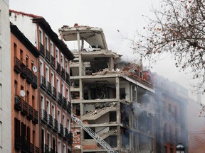 Smoke rises from a damaged building after an explosion in Madrid's downtown, on Wednesday, Jan. 20, 2021.