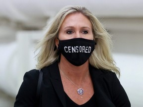 U.S. Representative Marjorie Taylor Greene (R-GA) wears a mask reading "Censored" as she walks to the House floor during debate on the second impeachment of President Donald Trump at the U.S. Capitol in Washington, D.C., Jan. 13, 2021.