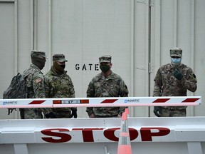 In this file photo taken on January 8, 2021 National Guard soldiers provide security around the U.S. Capitol in Washington.