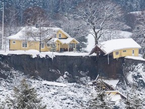A damaged house is seen at a landslide area in Ask, Norway, on Friday, Jan. 1, 2021, a few days after a landslide.