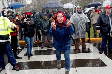 A supporter of U.S. President Donald Trump yells at counter-demonstrators and members of the press at a rally in support of Trump at the Oregon State Capitol in Salem, Oregon, U.S. January 6, 2021.  REUTERS/Terray Sylvester