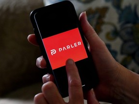 This illustration file photo taken July 2, 2020 shows social media application logo Parler displayed on a phone in Arlington, Va.