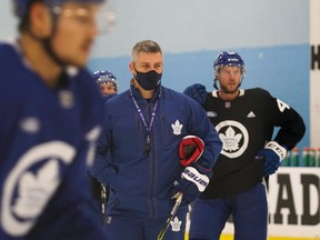 Sheldon Keefe looks on as the Maple Leafs run through training-camp drills on Wednesday at the Ford Performance Centre.