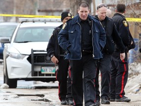 Winnipeg Police investigate after a male was shot in the 600 block of Manitoba Avenue in Winnipeg, Man. Monday, April 7, 2014.