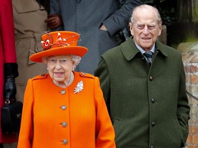 In this file photo taken on December 25, 2017 Britain's Queen Elizabeth II  and Prince Philip, Duke of Edinburgh, leave after attending the Royal Family's traditional Christmas Day church service at St Mary Magdalene Church.