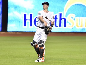 J.T. Realmuto of the Miami Marlins warms up before the start of a game against the St. Louis Cardinals at Marlins Park on August 8, 2018 in Miami.
