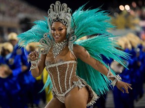 A reveller of the Unidos da Tijuca samba school performs during the second night of Rio's Carnival at the Sambadrome in Rio de Janeiro, Brazil, on February 12, 2018.