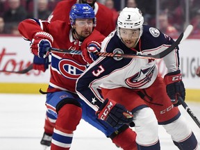 Montreal Canadiens forward Tomas Tatar, left, slashes Columbus Blue Jackets defenceman Seth Jones, right, during the second period at the Bell Centre in Montreal, Feb. 2, 2020.