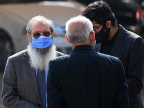 Ahmed Omar Saeed Sheikh's father Saeed Sheikh (left) leaves the Supreme Court building in Islamabad on January 28, 2021.