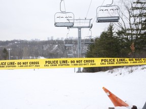 Yellow police tape at the ski and snowboard hill at Earl Bales Park. which is closed due to the COVID lockdown, on Tuesday January 5, 2021.